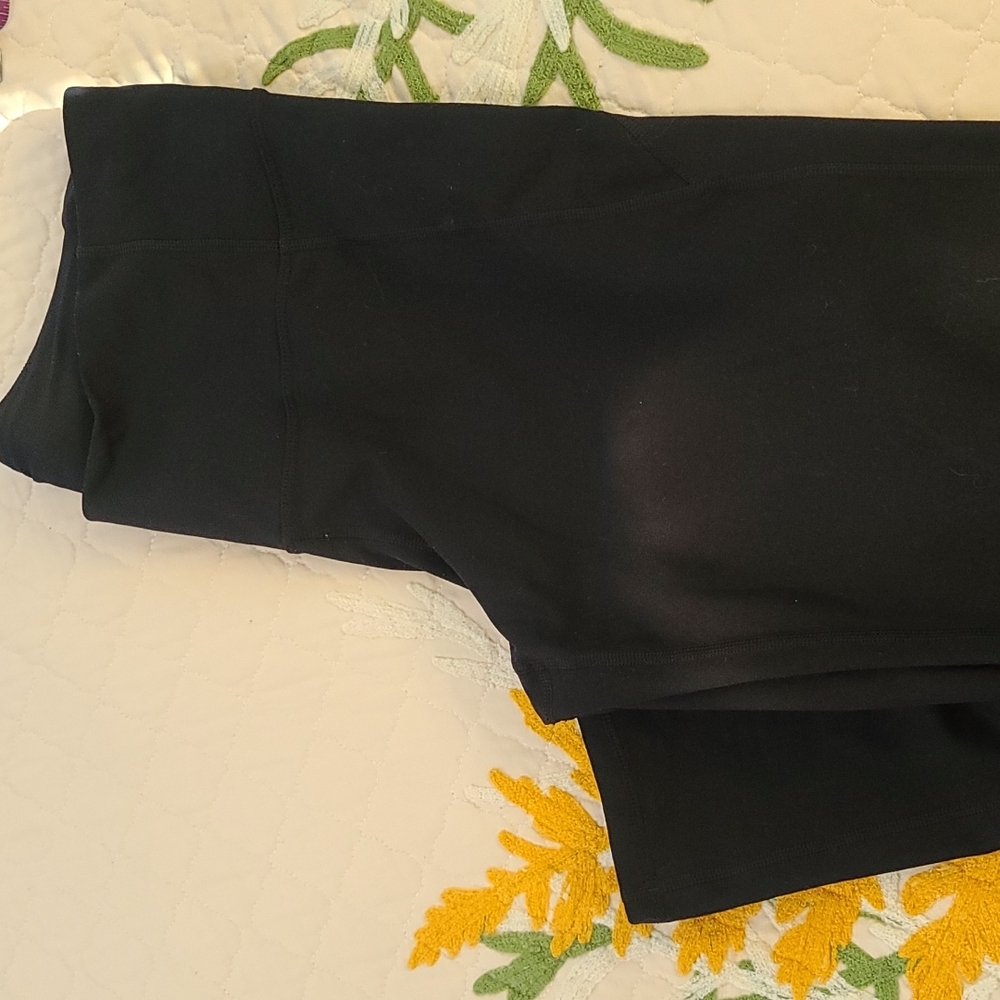 Under Armor black flare yoga pants.